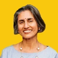 Headshot of Lalitha on a dandelion yellow background.