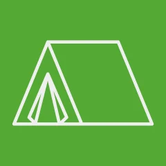 Icon of a tent over a grass-colored background