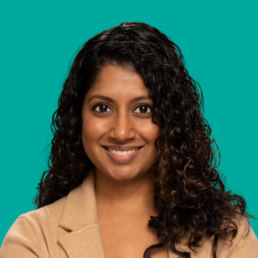 Headshot of Aditi Luminet over an emerald colored background