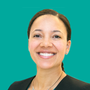 Headshot of Amy Saxton over a teal colored background