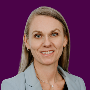 Headshot of Oesa Hauch on a plum colored background