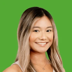Headshot of Kathy Thin over a grass-colored background