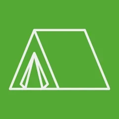 Icon of a tent over a grass-colored background