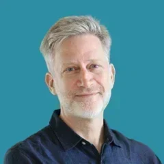 Headshot of Mark Sedway over a pond colored background