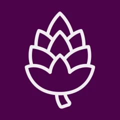 Icon of an acorn on a plum colored background