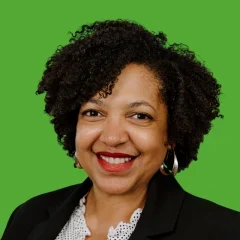 Headshot of Nancy Sanabria over a lime green background