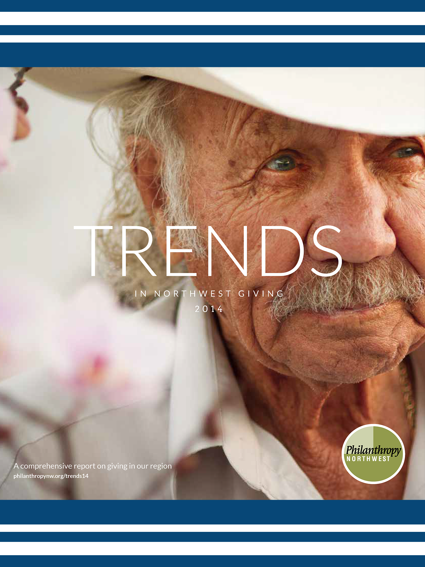 Cover image for Trends in NW Giving 2014 report-a elder man with gray hair and mustache wearing a white shirt and white cowboy hat
