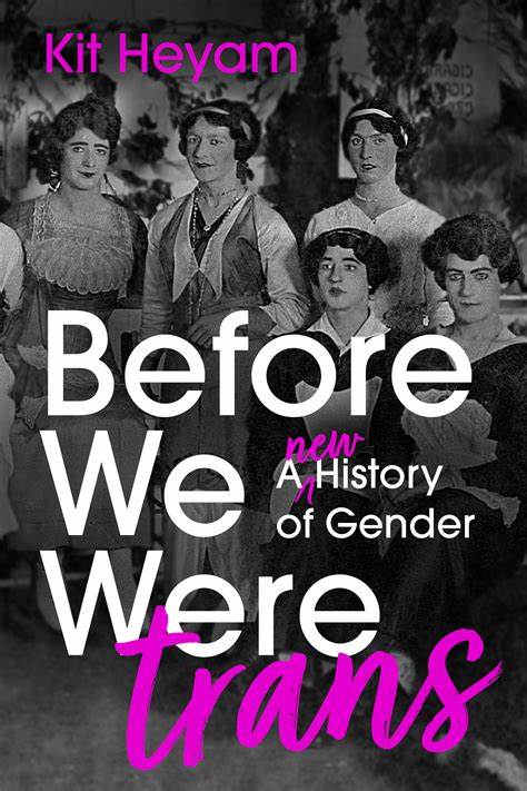 Book cover for “Before We Were Trans: A New History of Gender” by Kit Heyam, featuring a black-and-white historical group photo with bold white and hot pink title text layered over it.