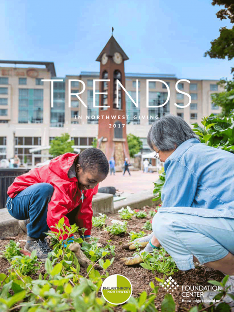 Image of Trends in NW Giving 2017 report cover with a boy and a woman working in a garden