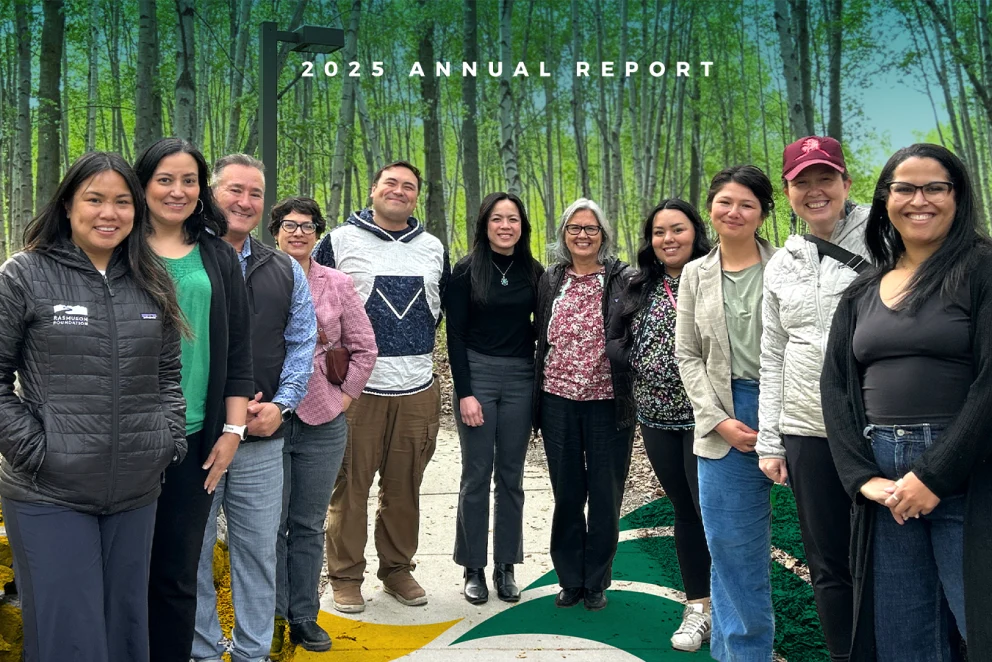Cover image for Philanthropy Northwest’s 2025 Annual Report, featuring a group of people standing together on a path in front of a birch forest backdrop. White text at the top reads, “2025 Annual Report.”
