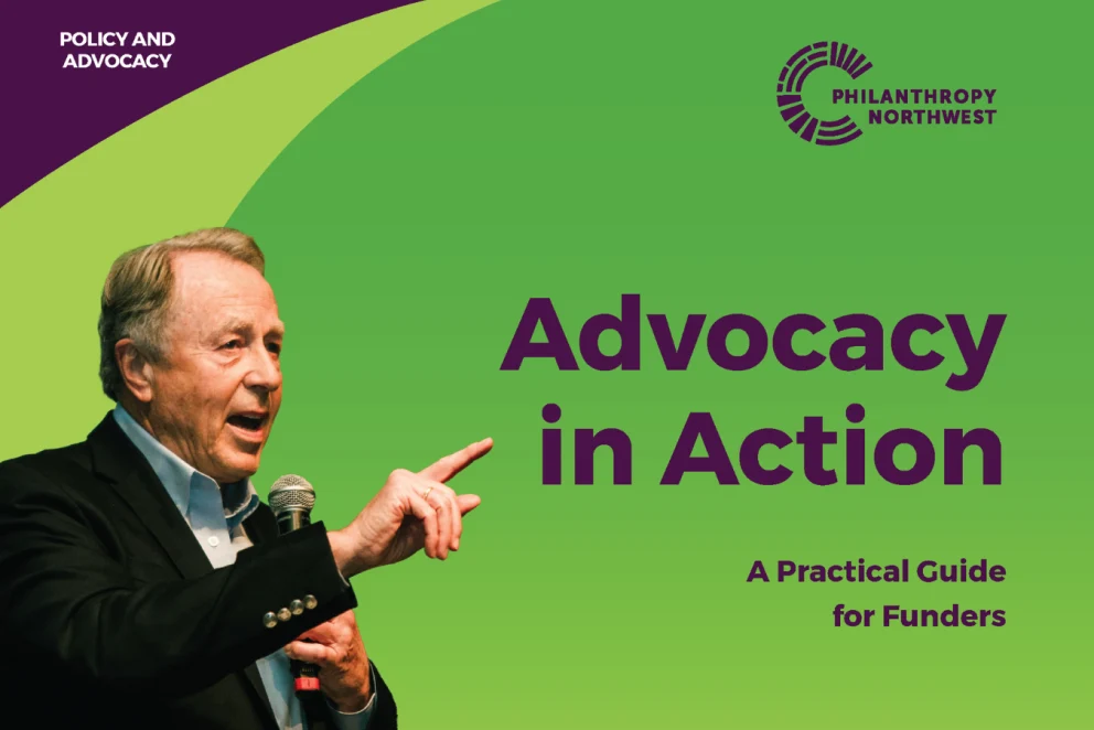 Graphic with a green background and purple accents, titled “Advocacy in Action: A Practical Guide for Funders.” A man on the left speaks into a microphone and points, with “Policy and Advocacy” text in the top left and the Philanthropy Northwest logo in the top right.