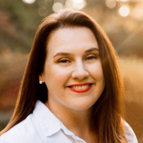 Headshot of Heidi Pelletie in front a nature background