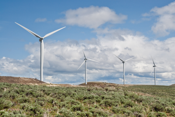  Turbines in the Kittitas Valley with blue skies and clouds in the background near Ellensburg, Washington State