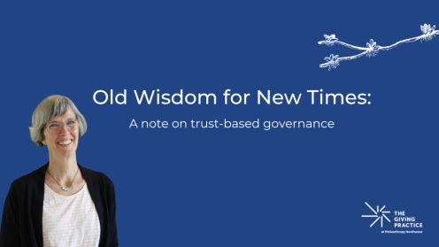 "Old Wisdom for New Times: A Note on Trust-Based Governance." The image features Rosalie with short gray hair, glasses, and a black cardigan over a light pink shirt. The background is blueberry with a white sketch of a budding tree branch