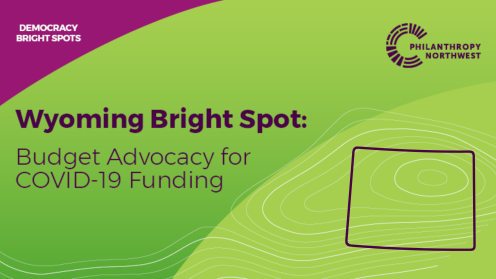 Graphic titled “Wyoming Bright Spot: Budget Advocacy for COVID-19 Funding,” with a plum header labeled “Democracy Bright Spots,” Philanthropy Northwest branding, and a simple outline of Wyoming over a grass-to-lime gradient background with contour lines.