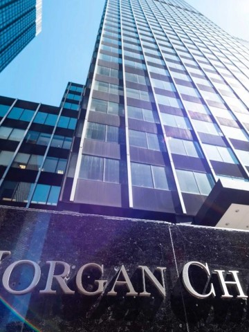A view of JBMorgan Chase & Co office towers with the company name prominently shown with an angle of sunlight accent