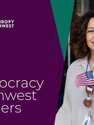Plum purple graphic that says "Democracy Northwest Funders" in white text in the left corner. On the right is a photo of a lady with curly hair holding a small American flag in her hand and an "I Voted" sticker on her shirt.