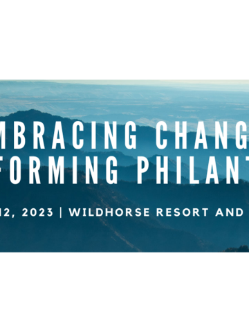 An image of rolling, blue hills with the text "Embracing Change: Transforming Philanthropy" overlaid on top of it.