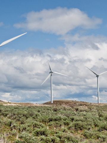  Turbines in the Kittitas Valley with blue skies and clouds in the background near Ellensburg, Washington State