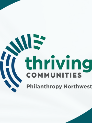 A logo with the words "Thriving Communities", accompanied by "Philanthropy Northwest" beneath it. The design features a circular pattern of blue and green lines on the left side, with a white background creating a dynamic wave