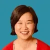 Headshot of Katie Hong on a pond-colored background