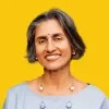 Lalitha Vaidyanathan headshot over a dandelion colored background