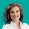 Headshot of Lisa Fisher, smiling, wearing a white blouse over a teal colored background