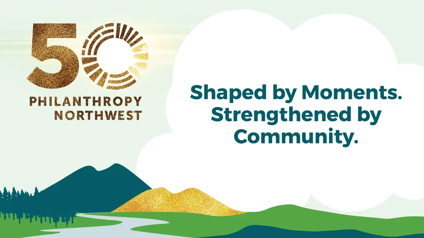 Graphic celebrating Philanthropy Northwest’s 50th anniversary. A gold “50 Philanthropy Northwest” anniversary mark appears on the left. Text on the right reads “Shaped by Moments. Strengthened by Community.” Stylized teal and green hills, evergreen trees, a winding river, gold-textured hills and large white cloud shapes fill the landscape-inspired design.