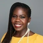 Headshot of Abre Conner over a gray background.